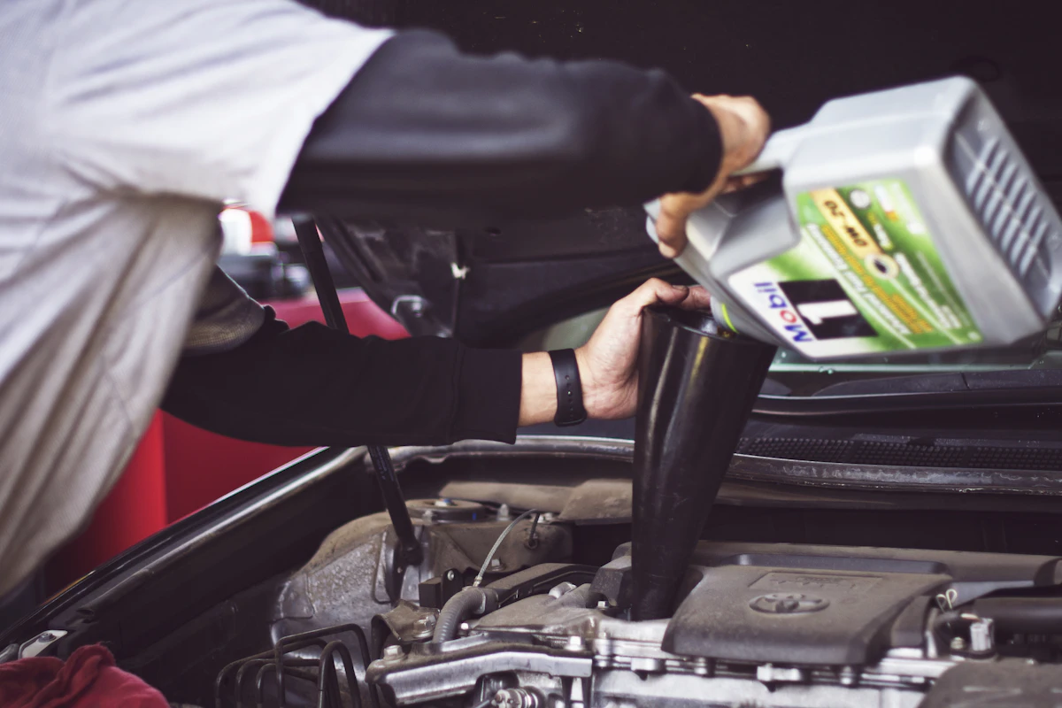 Mechanic working on a vehicle engine